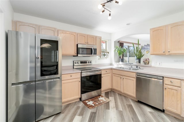 kitchen featuring light brown cabinets and stainless steel appliances