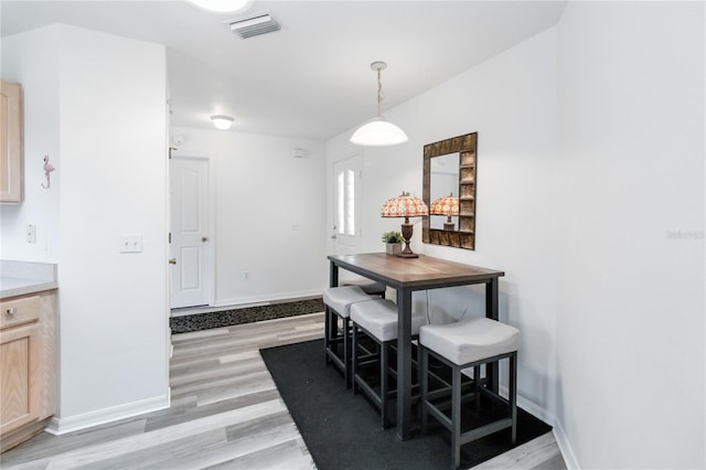 dining room featuring light hardwood / wood-style flooring