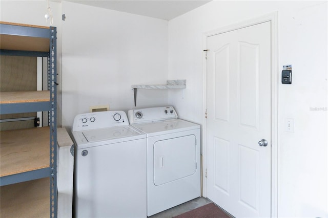 clothes washing area featuring washing machine and dryer