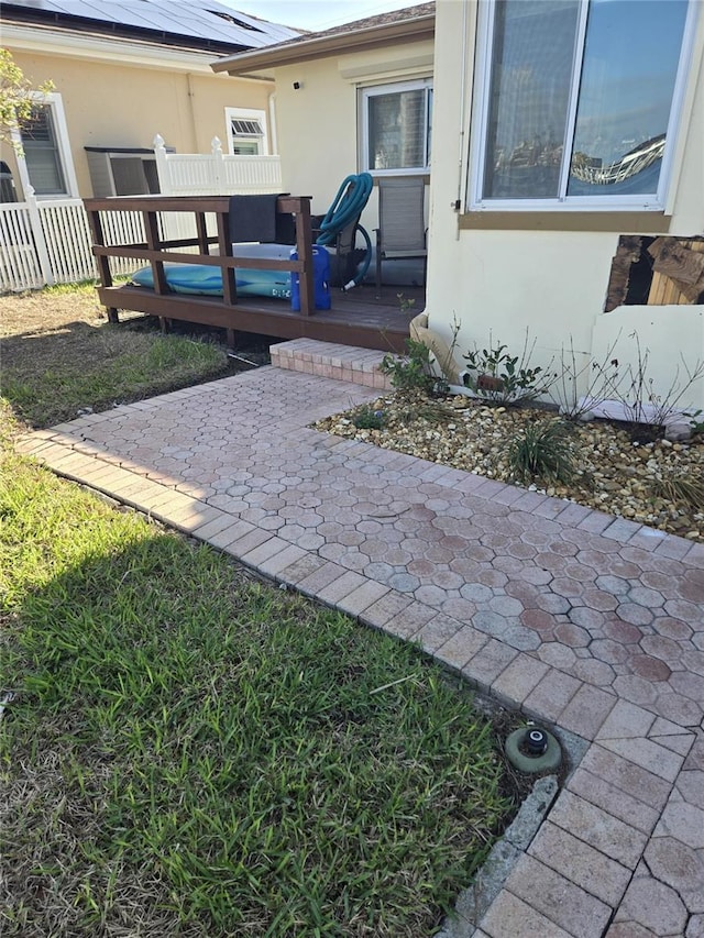 exterior space featuring a patio area and a wooden deck