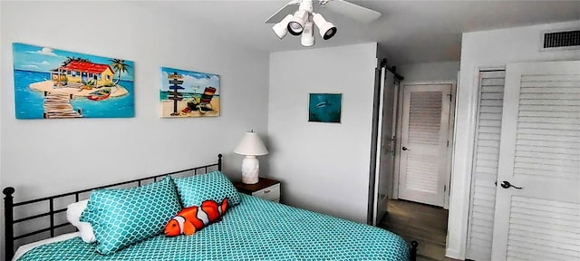 bedroom featuring wood-type flooring and ceiling fan