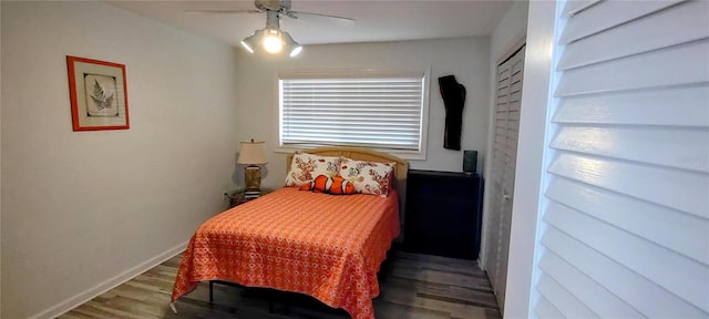 bedroom featuring ceiling fan, dark hardwood / wood-style flooring, and a closet