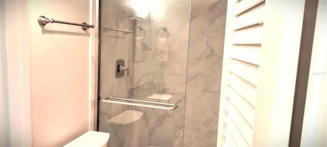 bathroom featuring an enclosed shower