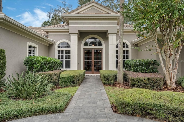 view of exterior entry featuring french doors