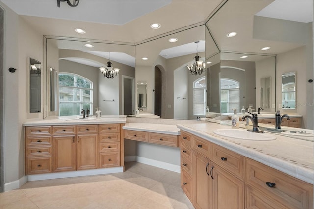 bathroom featuring vanity and a chandelier