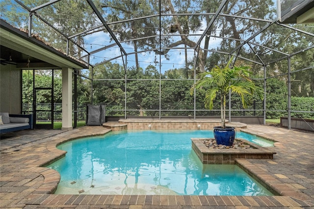 view of pool featuring a patio and a lanai