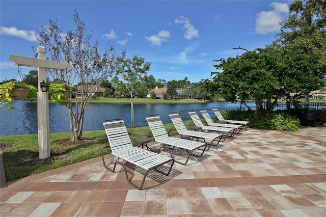 view of patio with a water view