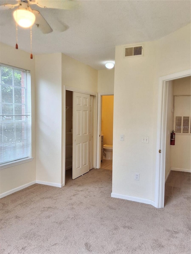 13103 Mulberry Park Dr Unit 817, Orlando, FL 32821 - unfurnished bedroom with carpet flooring, a closet, and a ceiling fan