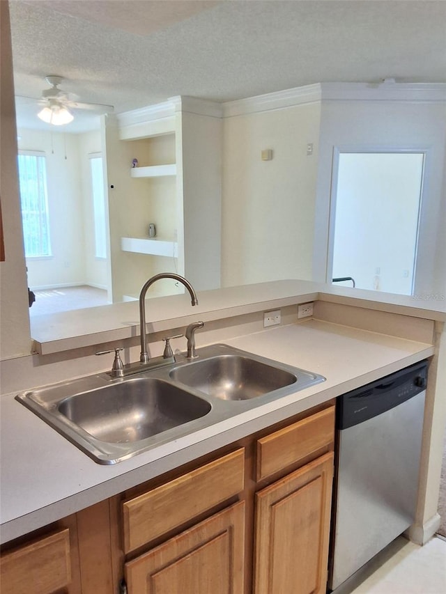 13103 Mulberry Park Dr Unit 817, Orlando, FL 32821 - kitchen with stainless steel dishwasher, a textured ceiling, light countertops, ceiling fan, and crown molding