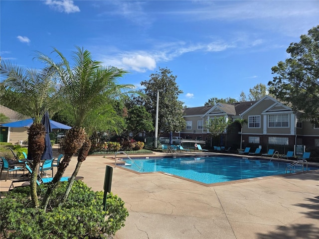 13103 Mulberry Park Dr Unit 817, Orlando, FL 32821 - community pool with a patio area