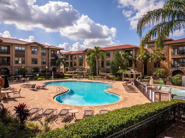 view of swimming pool featuring a gazebo and a patio area