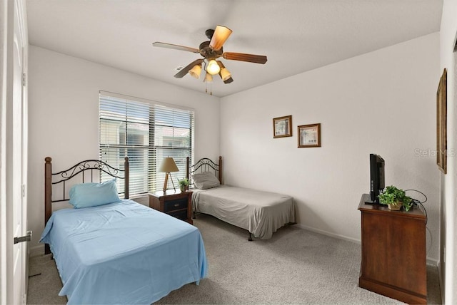 bedroom featuring ceiling fan and carpet flooring