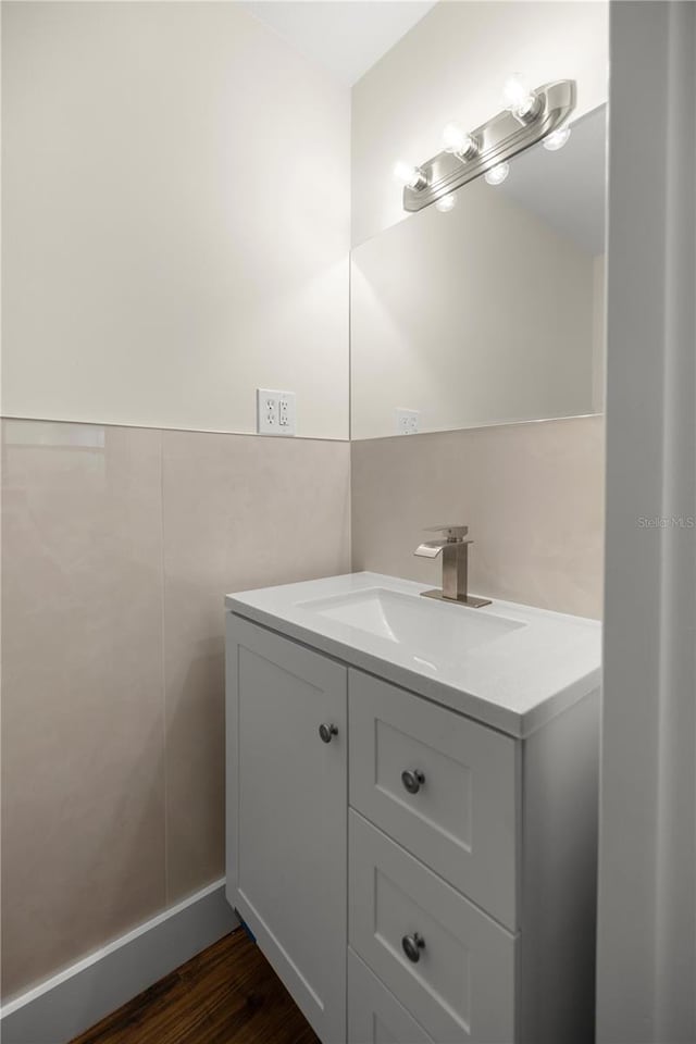 bathroom featuring hardwood / wood-style floors and vanity