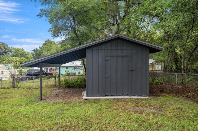 view of outbuilding with a lawn