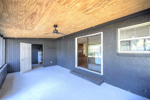 view of patio / terrace featuring electric water heater and ceiling fan