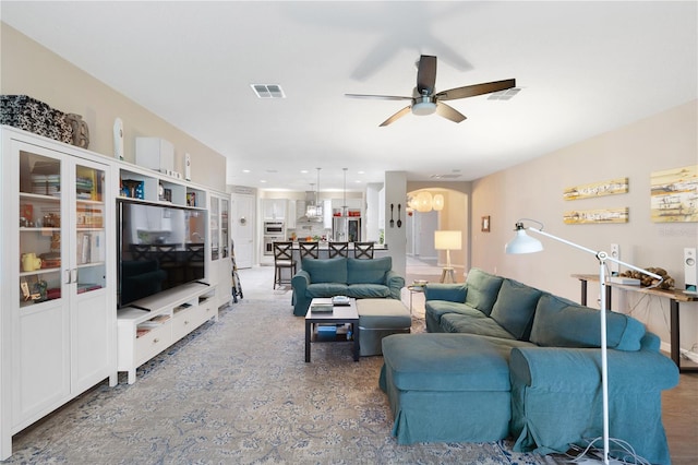 living room with ceiling fan