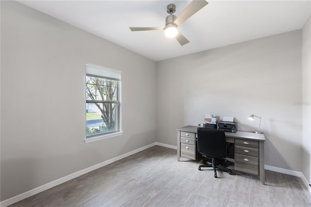 office space with light hardwood / wood-style floors and ceiling fan