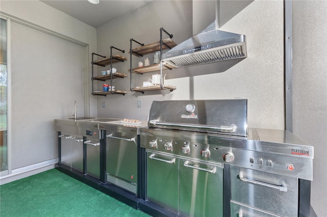 kitchen with dark carpet, range hood, and green cabinetry