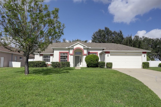 ranch-style home with a garage and a front lawn