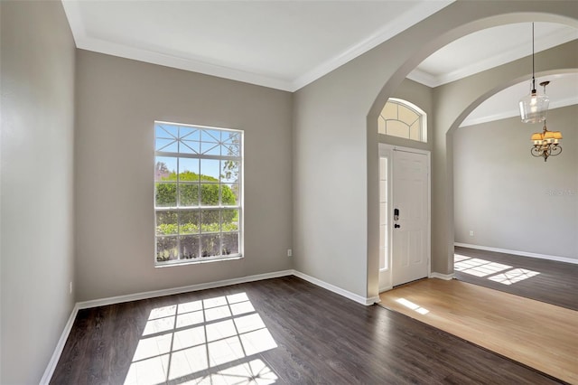 entrance foyer featuring dark hardwood / wood-style flooring and ornamental molding