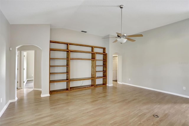 unfurnished room featuring light wood-type flooring, ceiling fan, and lofted ceiling