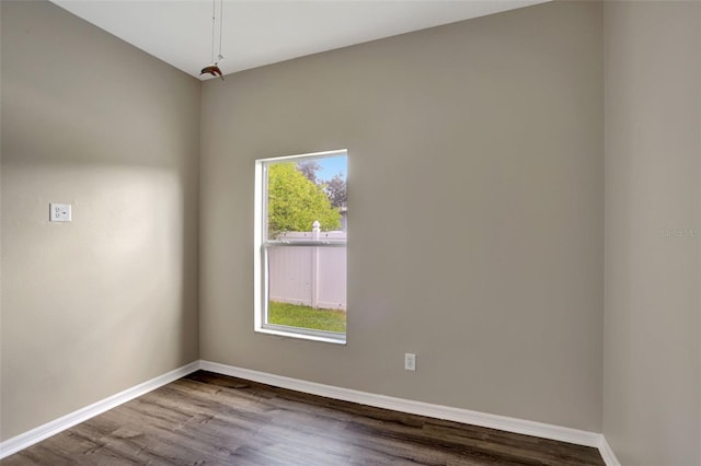 empty room with hardwood / wood-style flooring