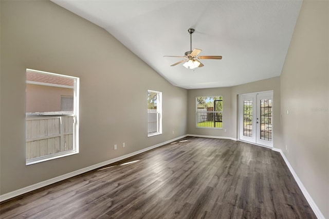 unfurnished room with ceiling fan, french doors, dark wood-type flooring, and vaulted ceiling