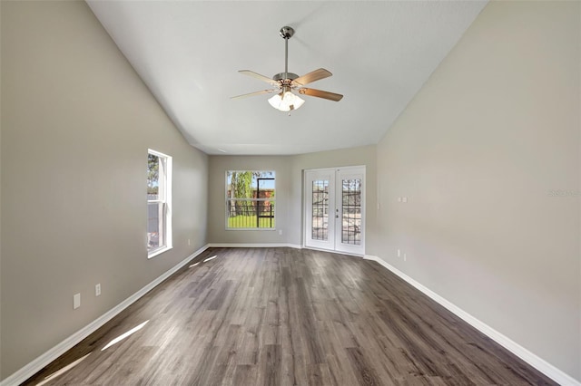 spare room with ceiling fan, dark hardwood / wood-style flooring, and french doors