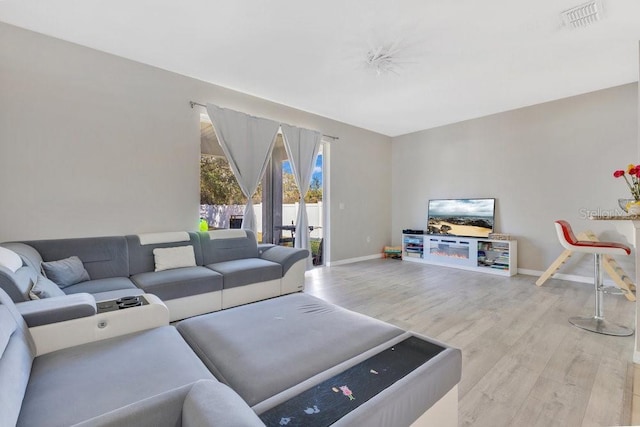 living room with light hardwood / wood-style floors