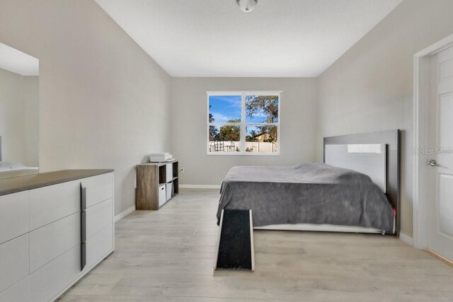 bedroom featuring light wood-type flooring