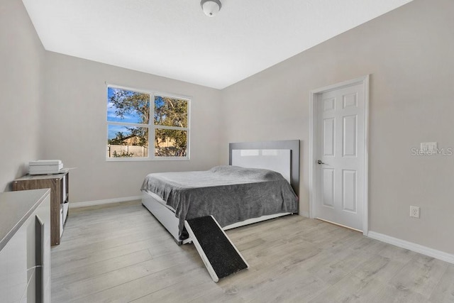 bedroom with light hardwood / wood-style flooring