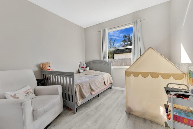 bedroom featuring light hardwood / wood-style floors