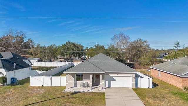 view of front of property featuring a garage and a front yard