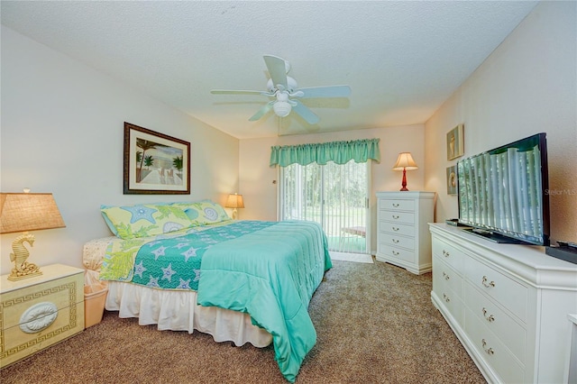 bedroom featuring carpet flooring, ceiling fan, and a textured ceiling