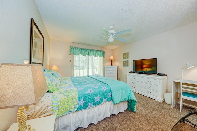 carpeted bedroom with a textured ceiling and ceiling fan