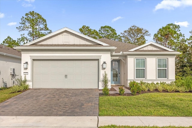 single story home featuring stucco siding, decorative driveway, a garage, and a front lawn