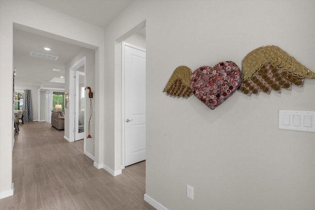 hall with light wood-type flooring