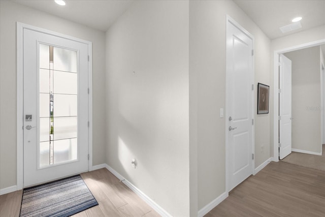 doorway to outside featuring light hardwood / wood-style flooring