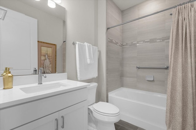 full bathroom featuring shower / tub combo, vanity, and toilet