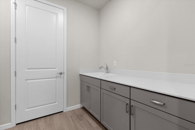 bathroom featuring vanity and wood-type flooring