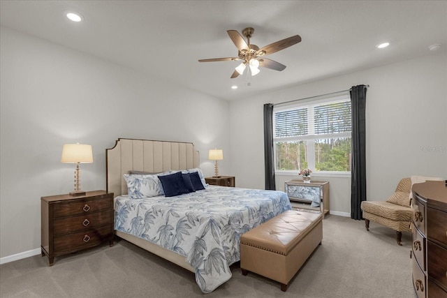 bedroom featuring ceiling fan and light colored carpet