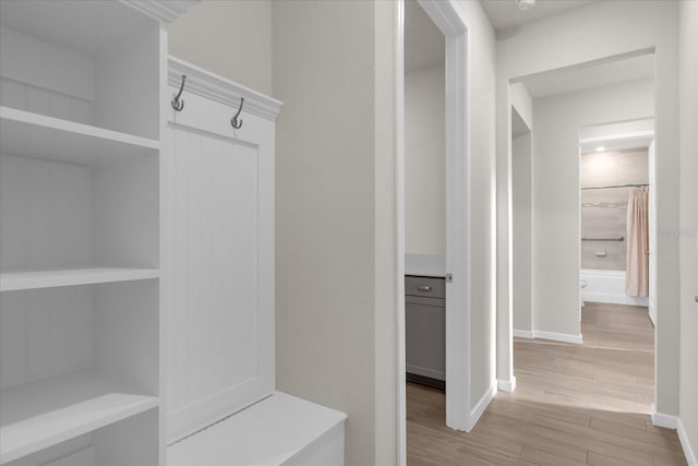 mudroom with light hardwood / wood-style floors