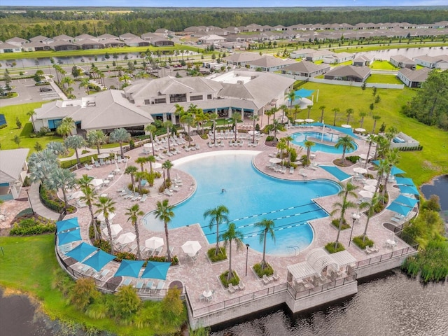 bird's eye view with a water view and a residential view