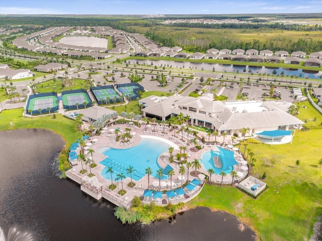 drone / aerial view with a water view and a residential view