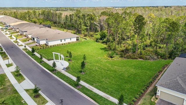 aerial view featuring a wooded view