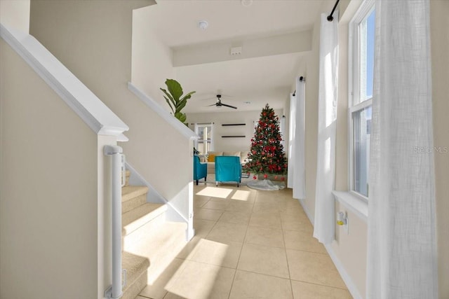 hall featuring light tile patterned floors