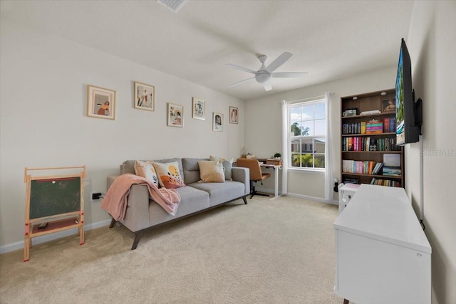 sitting room with light carpet and ceiling fan