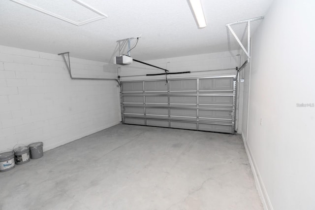 13869 SW 114th Pl, Dunnellon, FL 34432 - garage featuring a garage door opener and concrete block wall