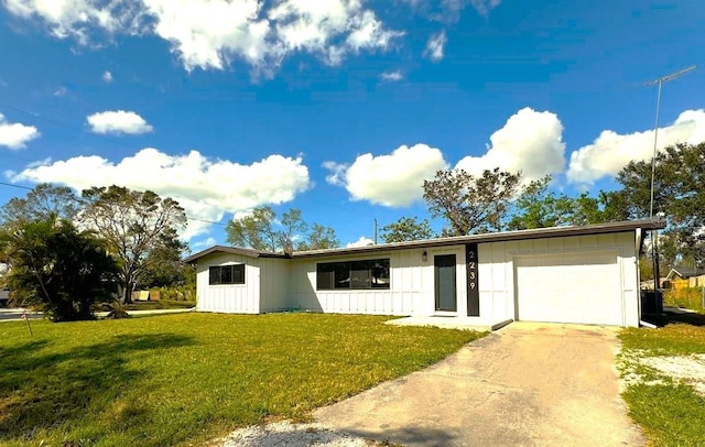 ranch-style home featuring a garage and a front yard