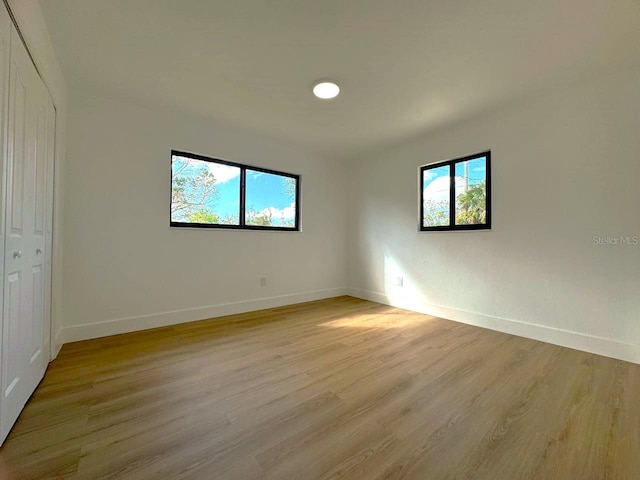 spare room featuring light hardwood / wood-style floors